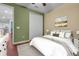 Bedroom with a queen-size bed and wood floors at 558 S Terrace Spring Dr, Orlando, FL 32828