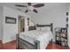 Bedroom with ceiling fan and en-suite bathroom access at 558 S Terrace Spring Dr, Orlando, FL 32828