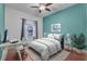 Bright bedroom with a queen bed and workspace at 558 S Terrace Spring Dr, Orlando, FL 32828