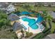 Community pool with surrounding lounge chairs and shade structures at 558 S Terrace Spring Dr, Orlando, FL 32828