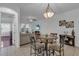 Small dining area with table and four chairs at 558 S Terrace Spring Dr, Orlando, FL 32828