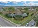 Community entrance with landscaping and pond at 558 S Terrace Spring Dr, Orlando, FL 32828
