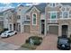 Townhouse community with two-story homes, garages, and landscaping at 558 S Terrace Spring Dr, Orlando, FL 32828
