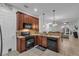 Eat-in kitchen with dark wood cabinets and granite countertops at 558 S Terrace Spring Dr, Orlando, FL 32828