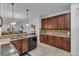 Spacious kitchen with dark wood cabinets and granite countertops at 558 S Terrace Spring Dr, Orlando, FL 32828