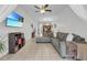 Spacious living room with L-shaped sofa, view of kitchen and tile floors at 558 S Terrace Spring Dr, Orlando, FL 32828