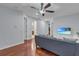 Loft area with L-shaped sofa, wood floors, and access to bedrooms at 558 S Terrace Spring Dr, Orlando, FL 32828
