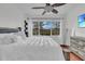 Bright bedroom with a ceiling fan and large windows at 558 S Terrace Spring Dr, Orlando, FL 32828