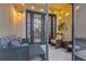 Cozy screened patio with wicker furniture, string lights, and potted plant at 558 S Terrace Spring Dr, Orlando, FL 32828