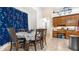 Bright dining area with a table for six near kitchen at 728 Longford Loop, Apopka, FL 32703