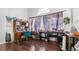 Home office with wood floors, large window and sewing machine at 728 Longford Loop, Apopka, FL 32703