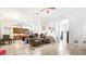 Open concept kitchen and living area with island and dining area at 728 Longford Loop, Apopka, FL 32703