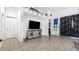 Bright living room with tile floors and a built-in entertainment center at 728 Longford Loop, Apopka, FL 32703