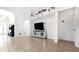Open living area with tile floors and a modern TV stand at 728 Longford Loop, Apopka, FL 32703
