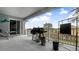 Covered patio with grill, outdoor seating, and backyard access at 728 Longford Loop, Apopka, FL 32703
