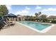 Inviting community pool with lounge chairs and umbrellas at 728 Longford Loop, Apopka, FL 32703
