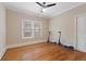 Bright bedroom featuring wood floors, natural light, and minimalist design at 832 N Summerlin Ave, Orlando, FL 32803