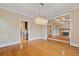 Elegant dining room featuring hardwood floors, chandelier lighting, and seamless flow into the living spaces at 832 N Summerlin Ave, Orlando, FL 32803