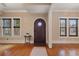 Bright entryway with hardwood floors and a charming door at 832 N Summerlin Ave, Orlando, FL 32803