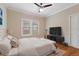Serene main bedroom with neutral tones, hardwood floors, and ample natural light at 832 N Summerlin Ave, Orlando, FL 32803