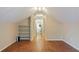 Upstairs hallway with hardwood floors and built-in shelves at 832 N Summerlin Ave, Orlando, FL 32803