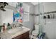 Clean bathroom with granite vanity, shower, and toilet at 860 Oak Dr, Groveland, FL 34736