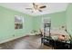 Light green bedroom with wood floors and a full-size bed at 860 Oak Dr, Groveland, FL 34736