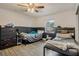 Bedroom with two twin beds, dresser, and closet at 860 Oak Dr, Groveland, FL 34736