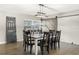 Dining room featuring a large farmhouse table and sliding barn door at 860 Oak Dr, Groveland, FL 34736