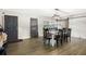 Bright dining room with a rustic table and chairs, featuring a barn door at 860 Oak Dr, Groveland, FL 34736
