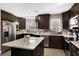 Spacious kitchen with dark cabinets and granite island at 860 Oak Dr, Groveland, FL 34736