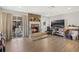 Spacious living area with a fireplace, large TV, and plenty of natural light at 860 Oak Dr, Groveland, FL 34736