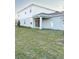 Large backyard with green grass and patio at 10876 Waterwood Aly, Orlando, FL 32829