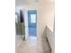 Bathroom with double vanity, shower, and view into bedroom at 10876 Waterwood Aly, Orlando, FL 32829