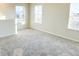Bright bedroom with neutral carpet and three windows at 10876 Waterwood Aly, Orlando, FL 32829