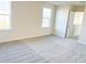 Bedroom with carpet, window, and door at 10876 Waterwood Aly, Orlando, FL 32829