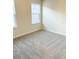 Bright bedroom with neutral carpet and one window at 10876 Waterwood Aly, Orlando, FL 32829