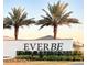 Community entrance with signage and landscaping at 10876 Waterwood Aly, Orlando, FL 32829