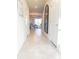 Light-filled entry hall showcasing tile floors and a full-length mirror at 10876 Waterwood Aly, Orlando, FL 32829