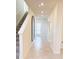 Bright entryway with tile floors and mirror at 10876 Waterwood Aly, Orlando, FL 32829