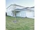 Two-story home with attached garage and front yard at 10876 Waterwood Aly, Orlando, FL 32829