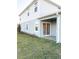 House exterior, side view with covered patio and landscaping at 10876 Waterwood Aly, Orlando, FL 32829
