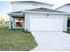 Two-story house with a light blue exterior at 10876 Waterwood Aly, Orlando, FL 32829