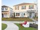 Two-story house with light blue and white siding, landscaping, and a driveway at 10876 Waterwood Aly, Orlando, FL 32829