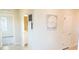 Hallway with light walls, tiled floor, and doors to other rooms at 10876 Waterwood Aly, Orlando, FL 32829