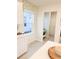 Bright kitchen with adjacent laundry and built-in storage at 10876 Waterwood Aly, Orlando, FL 32829