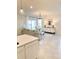 Spacious living room with open floor plan, neutral decor, and natural light at 10876 Waterwood Aly, Orlando, FL 32829