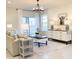 Living area with large windows, comfy seating and a statement art piece at 10876 Waterwood Aly, Orlando, FL 32829