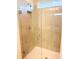 Large shower with glass enclosure and neutral tile at 10876 Waterwood Aly, Orlando, FL 32829