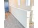 Upstairs hallway with carpet and a white wall at 10876 Waterwood Aly, Orlando, FL 32829